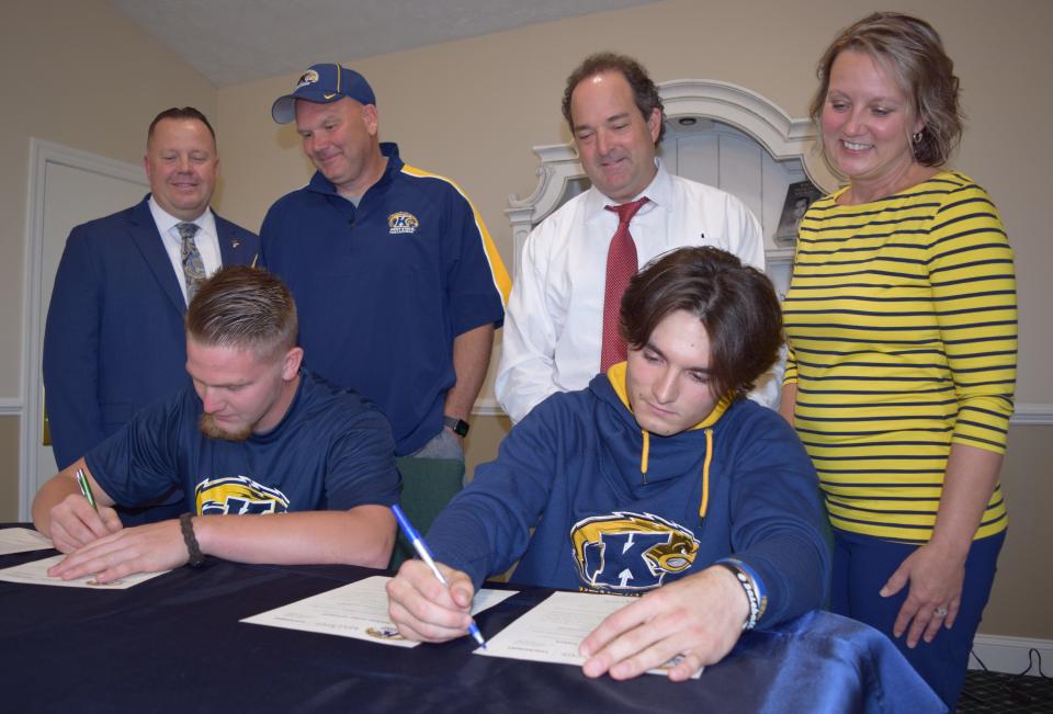 Signing a Letter of Intent to attend Kent State Tuscarawas were Levi Belcher (seated left) and Steve Michniak. In the back row are New Bethel Baptist Church Pastor David Ballert, Fred Belcher (Levi’s father), along with Steve and Dana Michniak (Steve’s father and mother).