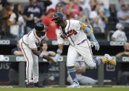 Atlanta Braves' Ronald Acuna Jr., right, celebrates with third base coach Ron Washington after hitting a home run off St. Louis Cardinals pitcher Kwang Hyun Kim in the third inning of the second baseball game of a doubleheader on Sunday, June 20, 2021, in Atlanta. (AP Photo/Ben Margot)