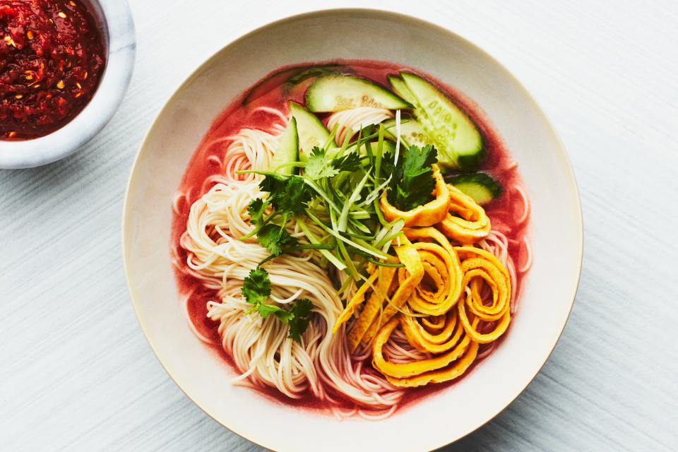 This Korean-inspired chilled tomato broth is topped with noodles and crunchy vegetables for a refreshing summer dinner. <a href="https://www.epicurious.com/recipes/food/views/kuksi-noodles-with-chilled-tomato-broth?mbid=synd_yahoo_rss" rel="nofollow noopener" target="_blank" data-ylk="slk:See recipe.;elm:context_link;itc:0;sec:content-canvas" class="link ">See recipe.</a>