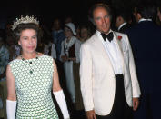 <p>Pictured here on Aug. 1, 1976, Queen Elizabeth ll is attending an event with former Prime Minister Pierre Trudeau, where she's seen wearing a tiara given to her by her grandmother, Queen Mary. It's known as "Granny's Tiara." (Photo by Anwar Hussein/Getty Images)</p> 