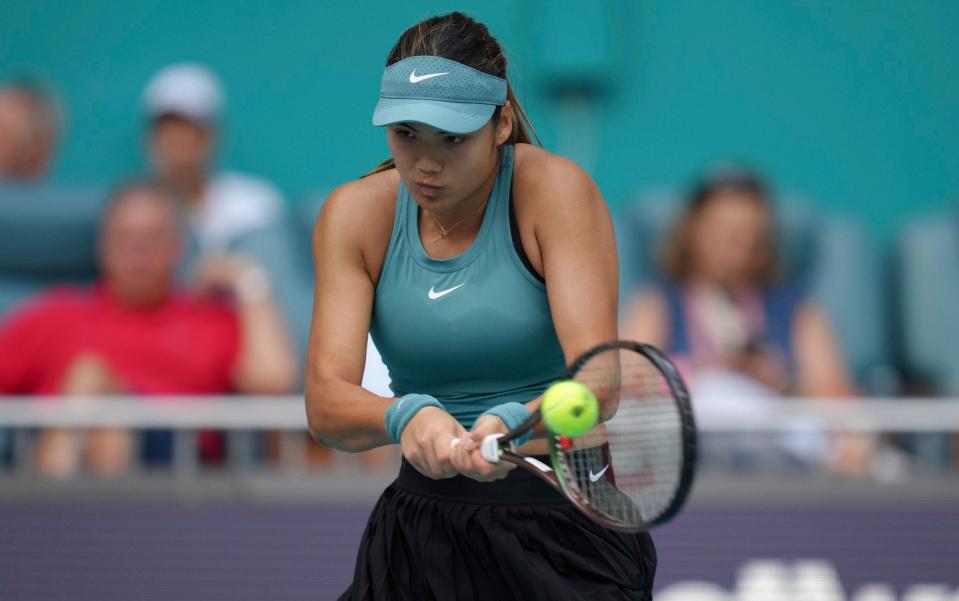 Emma Raducanu, of Great Britain, returns a volley from Bianca Andreescu, of Canada, in the first set of a match at the Miami Open tennis tournament - AP/Jim Rassol