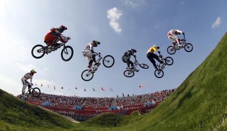 Cyclists compete in the men's BMX final during the London 2012 Olympic Games at the BMX Track in the Olympic Park August 10, 2012. REUTERS/Paul Hanna