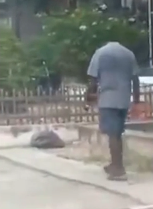 A man was spotted without a head walking in Malaysia. Photo: Facebook