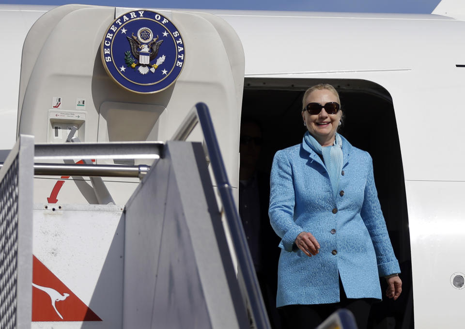 U.S. Secretary of State Hillary Rodham Clinton walks out of a plane upon her arrival at Perth International Airport, Tuesday, Nov. 13, 2012, in Perth, Australia. (AP Photo/Matt Rourke, Pool)