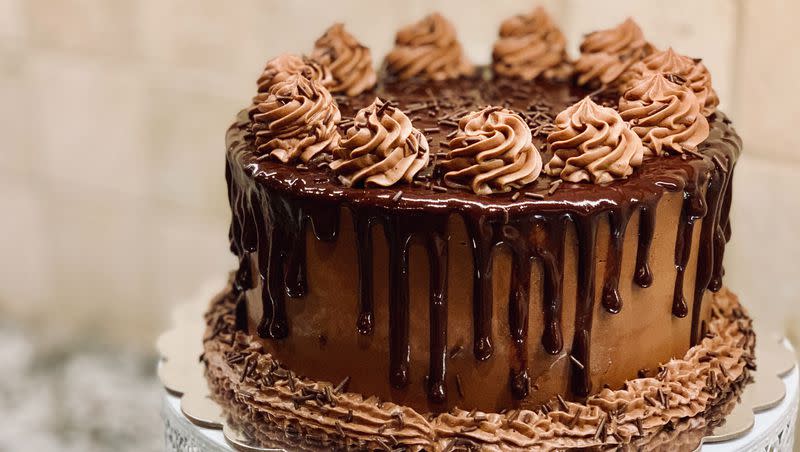 Chocolate cake on a stand.