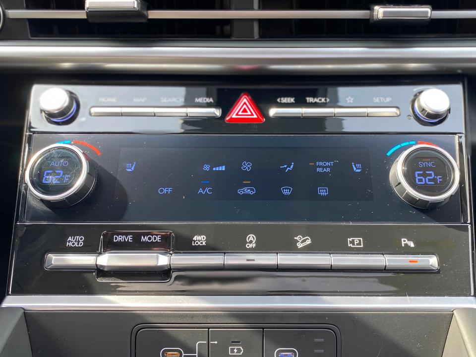 The touchscreen climate controls on a 2024 Hyundai Sante Fe XRT SUV.