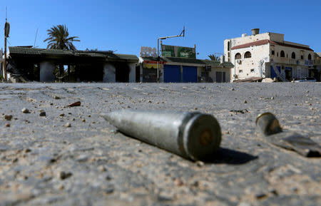 FILE PHOTO: Shell casings are seen on the ground during a fight between members of the Libyan internationally recognised government forces and Eastern forces in al-Yarmouk south of Tripoli, Libya May 7, 2019. REUTERS/Hani Amara/File Photo