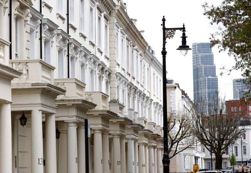 FILE PHOTO: New apartment blocks are seen behind traditional housing in London