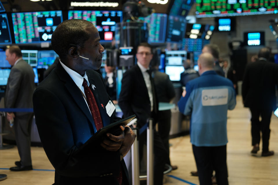 NEW YORK, NEW YORK - FEBRUARY 12: Traders work on the floor of the New York Stock Exchange (NYSE) on February 12, 2020 in New York City. The market closed up over 250 points as gains in tech companies and retailers outweighed concerns over the coronavirus. (Photo by Spencer Platt/Getty Images)