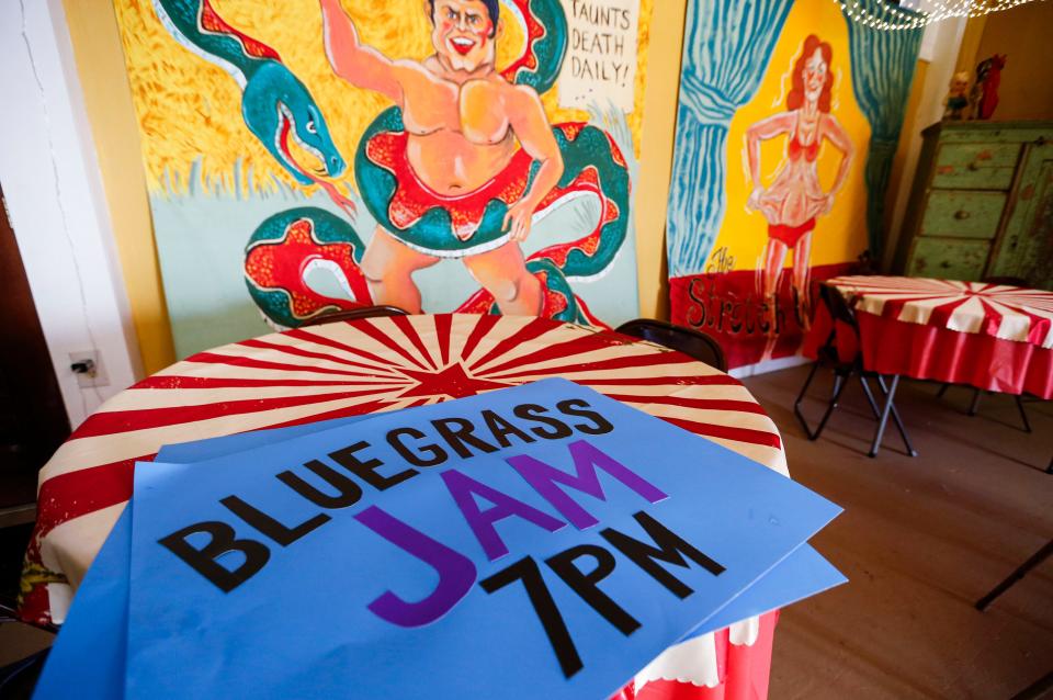 Signs to be placed outside for the evening's Bluegrass Jam at The Shoe Tree Listening Room on East St. Louis Street on Thursday, Feb. 8, 2024.