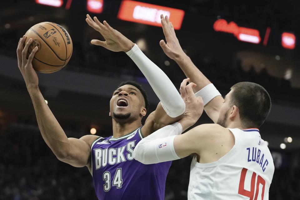 Milwaukee Bucks' Giannis Antetokounmpo shoots past Los Angeles Clippers' Ivica Zubac during the first half of an NBA basketball game Thursday, Feb. 2, 2023, in Milwaukee. (AP Photo/Morry Gash)