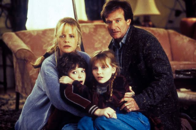 <p>Rob McEwan/TriStar Pictures/THA/Shutterstock </p> Bonnie Hunt, Bradley Pierce, Kirsten Dunst and Robin Williams in 'Jumanji,' 1995