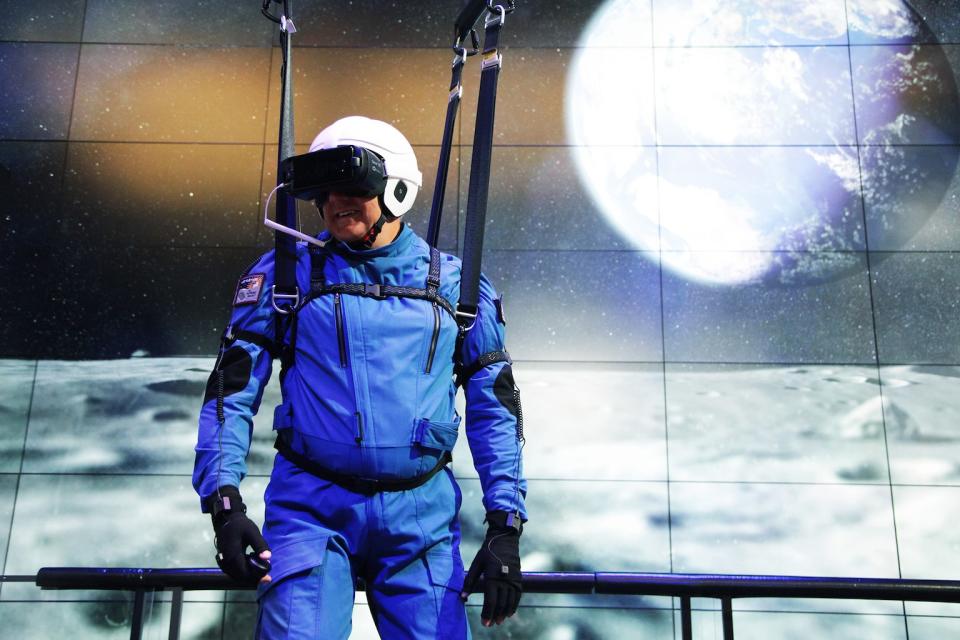 NASA astronaut Mike Massimino takes a virtual trip to the moon with Samsung's "A Moon for All Mankind" 4D virtual-reality experience in New York City on July 17, 2018. <cite>Samsung</cite>