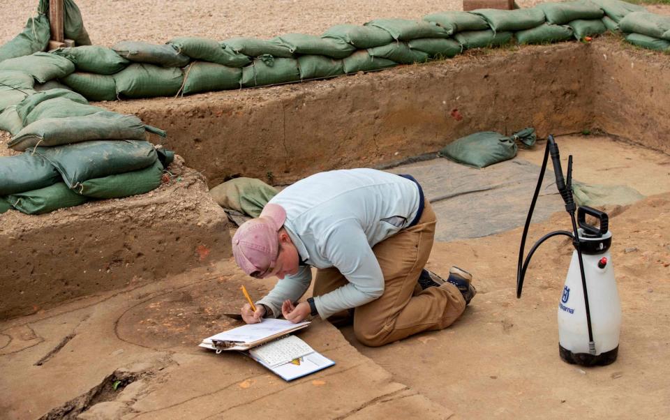 Caitlin Delmas, staff archaeologist, works on a dig site - RYAN M. KELLY/AFP via Getty Images