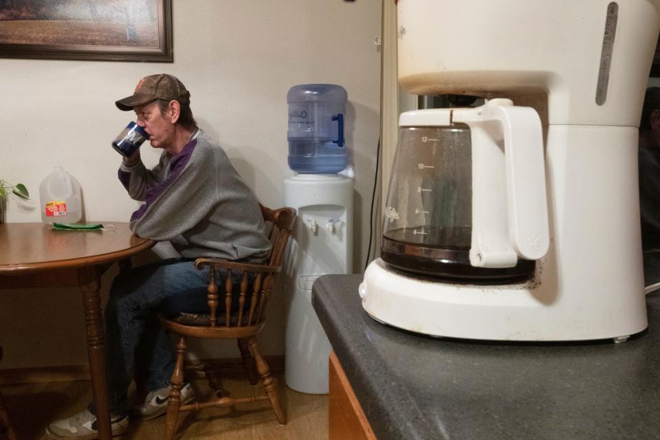 Tim Hartley, who drinks four pots of coffee a day, has to use bottled water because his well has been contaminated with PFAS. He is shown Wednesday, February 10, 2021 at his home on French Island near the airport in La Crosse, Wis. At least 40 wells that provide drinking water for residents on a North Side island in La Crosse were found to be contaminated with PFAS that are above recommended standards.
