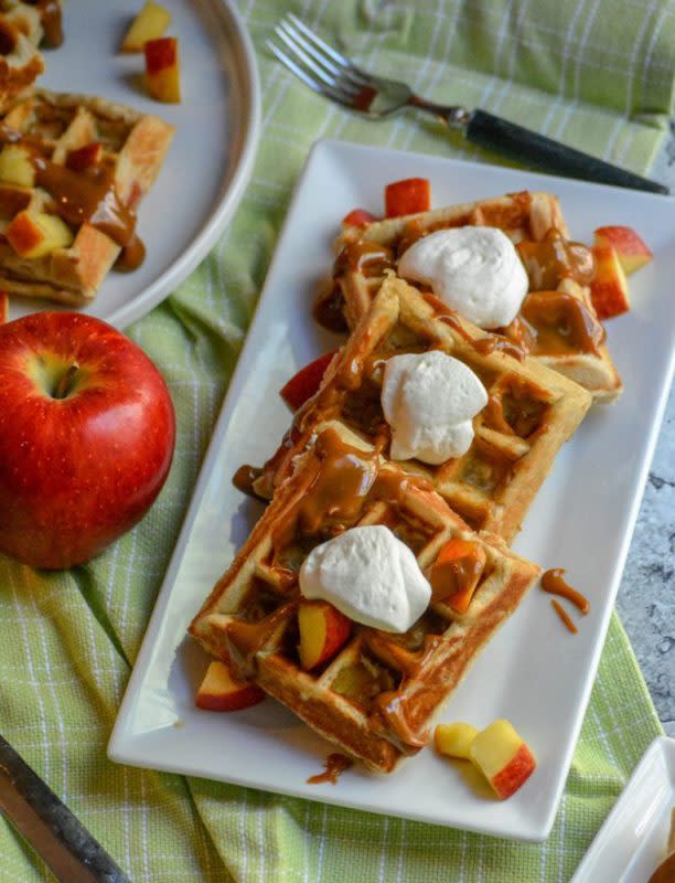 <p>4 Sons R Us</p><p>Fluffy big belgian waffles are stuffed with a sweet caramel apple filling and topped with a caramel drizzle. This breakfast recipe is decadent!</p><p><strong>Get The Recipe: <a href="https://4sonrus.com/caramel-apple-stuffed-waffles/" rel="nofollow noopener" target="_blank" data-ylk="slk:Caramel Apple Stuffed Belgian Waffles;elm:context_link;itc:0;sec:content-canvas" class="link ">Caramel Apple Stuffed Belgian Waffles</a></strong></p>