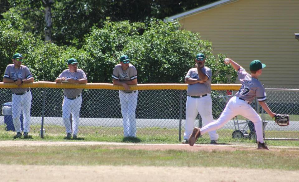 Dover's Connor Lynch delivers a pitch as coaches look on during the Cal Ripken 11-year-old state tournament last weekend in Swanzey.