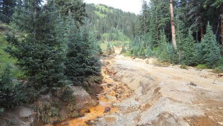 Yellow mine waste water from the Gold King Mine is seen in San Juan County, Colorado, in this picture released by the Environmental Protection Agency (EPA) taken August 7, 2015. REUTERS/EPA/Handout