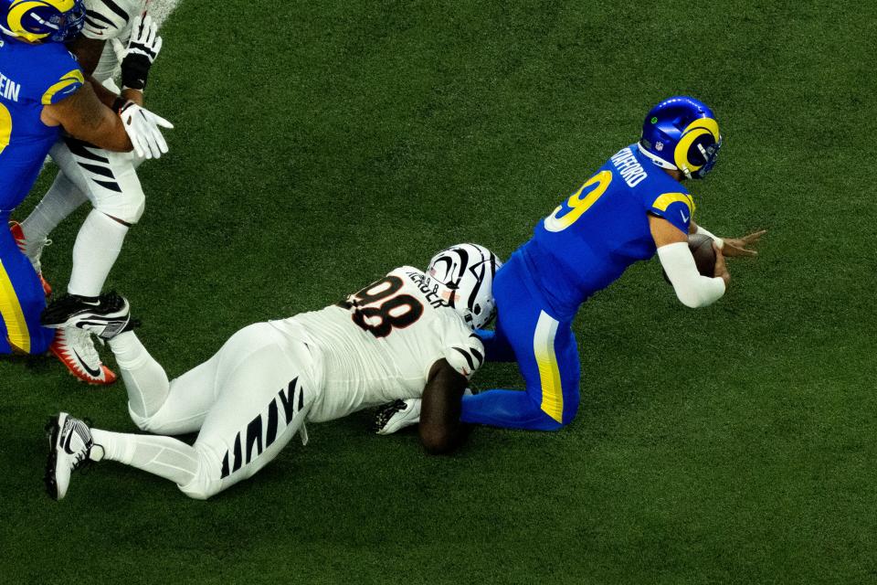 Cincinnati Bengals defensive tackle DJ Reader (98) sacks Los Angeles Rams quarterback Matthew Stafford (9) in the first quarter of the NFL game between the Cincinnati Bengals and Los Angeles Rams at Paycor Stadium in Cincinnati on Monday, Sept. 25, 2023.