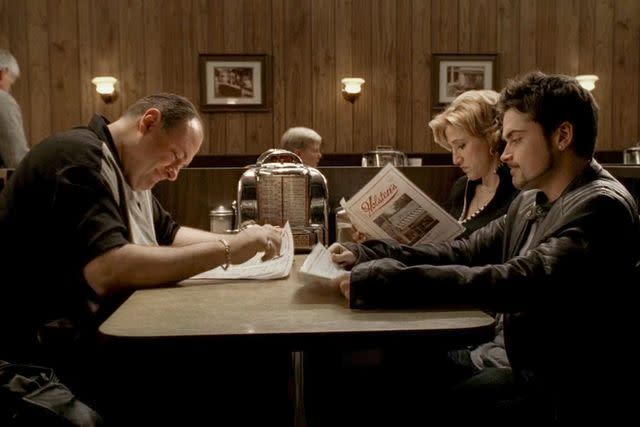 <p>HBO</p> James Gandolfini, Edie Falco, and Robert Iler on the final episode of 'The Sopranos'