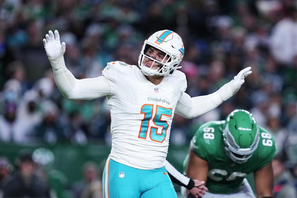 Miami Dolphins linebacker Jaelan Phillips (15) celebrates after sacking Philadelphia Eagles quarterback Jalen Hurts (1) during the first half of an NFL football game Sunday, Oct. 22, 2023, in Philadelphia. (AP Photo/Matt Rourke)