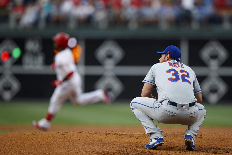 New York Mets starting pitcher Steven Matz, right, reacts after giving up a home run to Philadelphia Phillies' Jean Segura, back left, during the first inning of a baseball game, Monday, June 24, 2019, in Philadelphia. (AP Photo/Matt Slocum)
