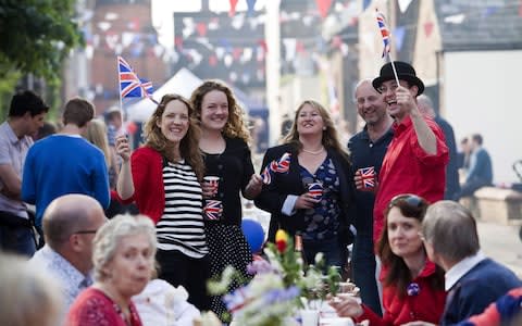 Residents at a Royal Wedding Street Party celebrate the marriage of Prince William and Catherine Middleton, in Chapel Street in Berkhamsted, 2011.  - Credit: David Levenson/Getty Images