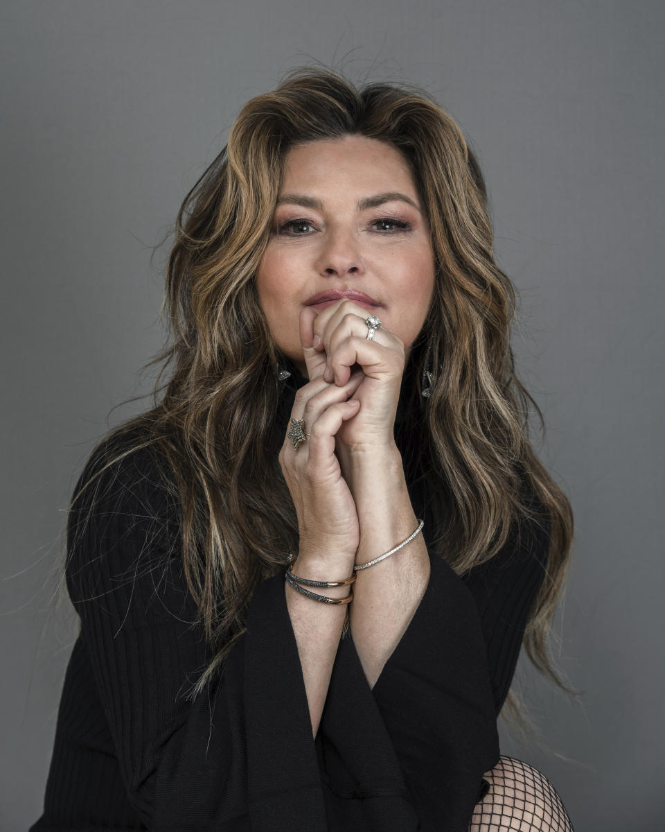 FILE - Shania Twain appears during a portrait session in New York on June 14, 2019. Twain is celebrating the 25th anniversary of the album that turned her into a global superstar. She is releasing a deluxe reissue set of her 1995 breakthrough album “The Woman in Me,” which became the best-selling record by a woman in country music at the time. (Photo by Christopher Smith/Invision/AP, File)