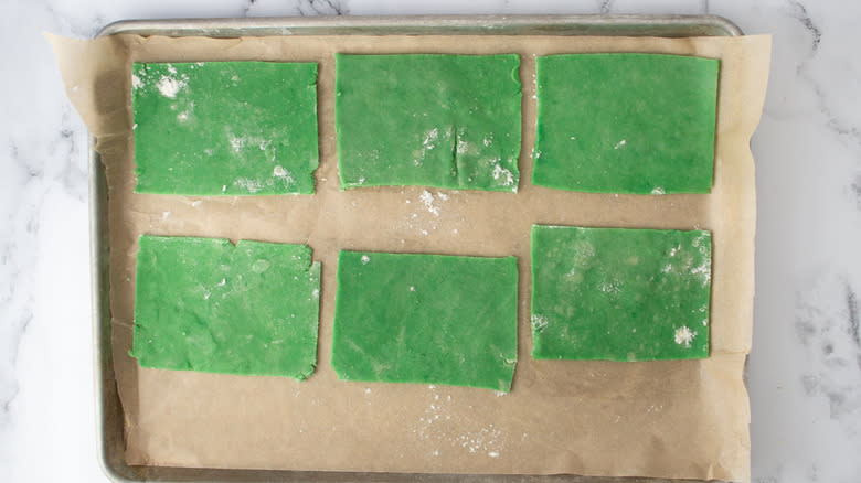 green dough rectangles on sheet