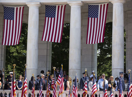 Flags are draped from the amphitheater as U.S. President Barack Obama takes part in Memorial Day ceremonies at Arlington National Cemetery in Virginia May 26, 2014. REUTERS/Joshua Roberts