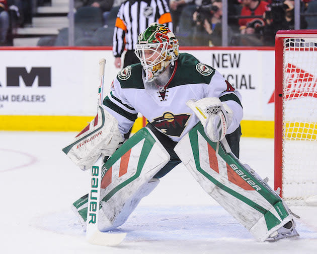 CALGARY, AB - FEBRUARY 17: Devan Dubnyk #40 of the Minnesota Wild in action against the Calgary Flames during an NHL game at Scotiabank Saddledome on February 17, 2016 in Calgary, Alberta, Canada. (Photo by Derek Leung/Getty Images)