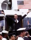 <p>Following his resignation, President Nixon flashes the V for Victory sign as he boards his Marine One helicopter for the last time, on the South Lawn of the White House, Aug. 9, 1974. (Photo: Stringer/Reuters) </p>