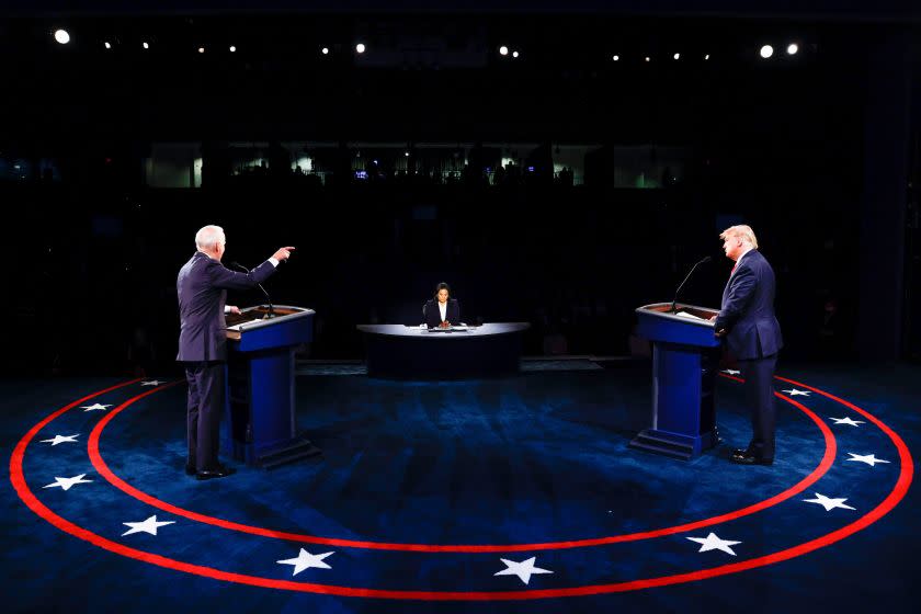 US President Donald Trump (R) Democratic Presidential candidate, former US Vice President Joe Biden and moderator, NBC News anchor, Kristen Welker (C) participate in the final presidential debate at Belmont University in Nashville, Tennessee, on October 22, 2020. (Photo by JIM BOURG / POOL / AFP) (Photo by JIM BOURG/POOL/AFP via Getty Images)