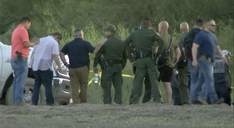 In this frame grab taken from video provided by KRGV, authorities stage near where a helicopter flying over the U.S.-Mexico border in Texas crashed, killing two National Guard soldiers and a Border Patrol agent, March 8, 2024. Authorities released the names of the two National Guard soldiers from New York and a Border Patrol agent who were killed. Authorities said Sunday, March 10, 2024 that the two soldiers with the New York Army National Guard who were killed in the crash were Chief Warrant Officer 2 Casey Frankoski, who was 28, and Chief Warrant Officer 2 John Grassia, who was 30. Border Patrol Agent Chris Luna, who was 49, was also killed.. (KRGV via AP, file)