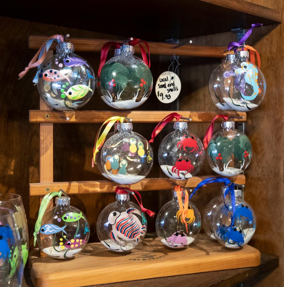 The Little Village in St. Andrews is one of several businesses in the area planning special sales and activities for Small Business Saturday. The store features a number of area artists like Jan Ord from Mexico Beach, who offers hand-painted glassware.