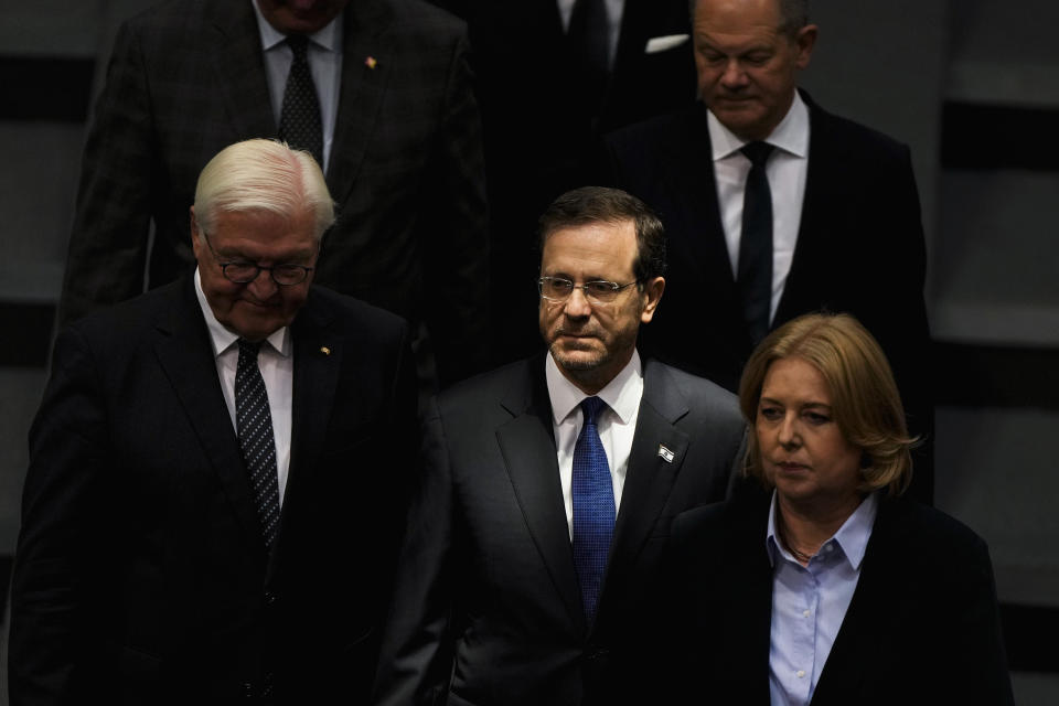 Israeli President Isaac Herzog, center, arrives with German President Frank-Walter Steinmeier, left, Parliament President Baerbel Bas, right, and Chancellor Olaf Scholz, background right, for a speech at the German parliament Bundestag at the Reichstag building in Berlin, Germany, Tuesday, Sept. 6, 2022. (AP Photo/Markus Schreiber)