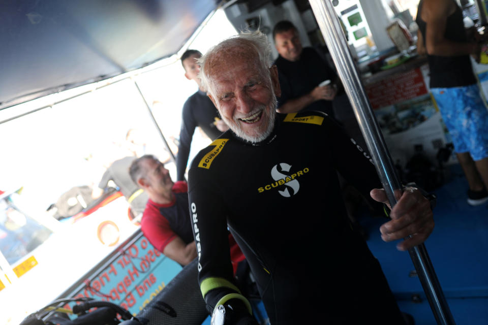 Ray Woolley, pioneer diver and World War 2 veteran, celebrates breaking a new diving record as he turns 95 and took the plunge at the Zenobia, a cargo ship wreck off the Cypriot town of Larnaca, Cyprus September 1, 2018. REUTERS/Yiannis Kourtoglou