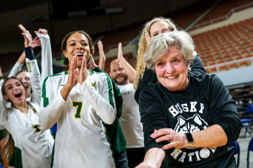 Valorie McKenzie of Horizon High School, right, celebrates her teams 4A title after beating Millennium High School in a three set sweep during the State girls volleyball championships at the Arizona Veterans Memorial Coliseum on Saturday, Nov. 13, 2021, in Phoenix. 