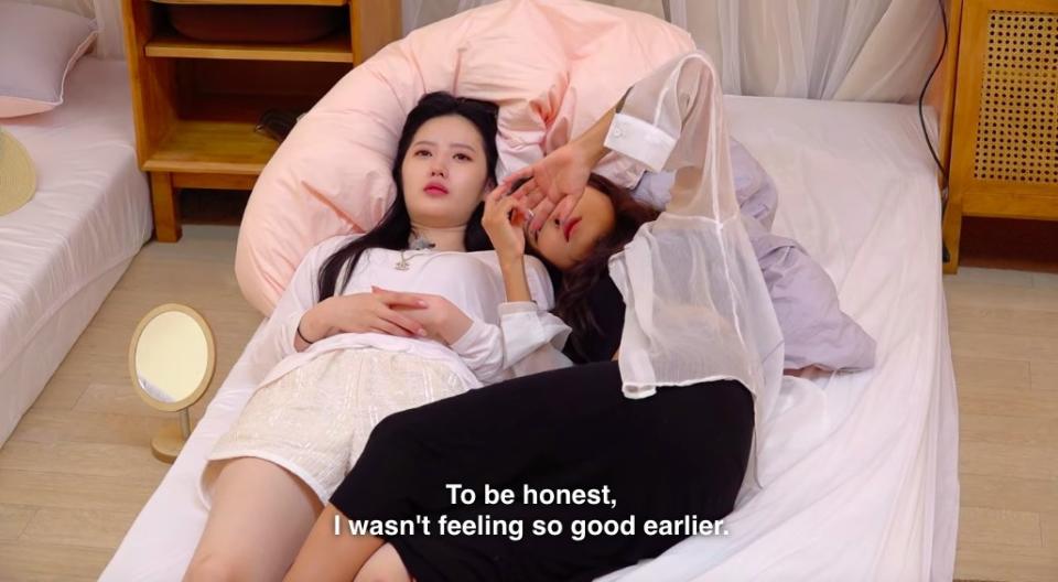 Min-ji lays with Yea-won and says "to be honest, I wasn't feeling so good earlier"