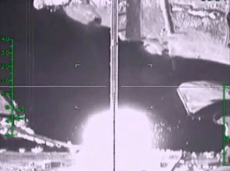 A frame grab taken from a footage released by Russia's Defence Ministry November 5, 2015, shows what Russia says is an explosion after air strikes carried out by the Russian air force on a bridge under militants' control near Raqqa, Syria. Russia's air force flew 81 sorties and hit 263 targets in Syria in the last two days, the Russian Defence Ministry said on Thursday. REUTERS/Ministry of Defence of the Russian Federation/Handout via Reuters ATTENTION EDITORS - THIS IMAGE WAS PROVIDED BY A THIRD PARTY. REUTERS IS UNABLE TO INDEPENDENTLY VERIFY THE AUTHENTICITY, CONTENT, LOCATION OR DATE OF THIS IMAGE. IT IS DISTRIBUTED EXACTLY AS RECEIVED BY REUTERS, AS A SERVICE TO CLIENTS. FOR EDITORIAL USE ONLY. NOT FOR SALE FOR MARKETING OR ADVERTISING CAMPAIGNS. NO RESALES. NO ARCHIVE. - RTX1UYTI