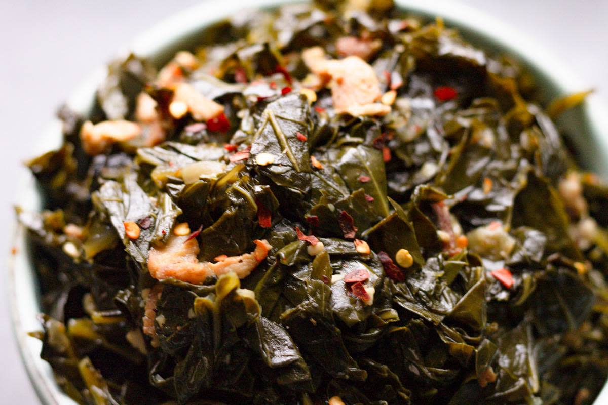 <p>On Ty's Plate</p><p>Spicy Southern Collard Greens with Bacon—soulful broth braised collard greens with bacon and a spicy blend of seasoning.</p><p><strong>Get the Recipe:</strong><a href="https://www.ontysplate.com/spicy-southern-collard-greens-with-bacon/" rel="nofollow noopener" target="_blank" data-ylk="slk:Spicy Southern Collard Greens with Bacon;elm:context_link;itc:0;sec:content-canvas" class="link rapid-noclick-resp"> <strong>Spicy Southern Collard Greens with Bacon</strong></a></p>