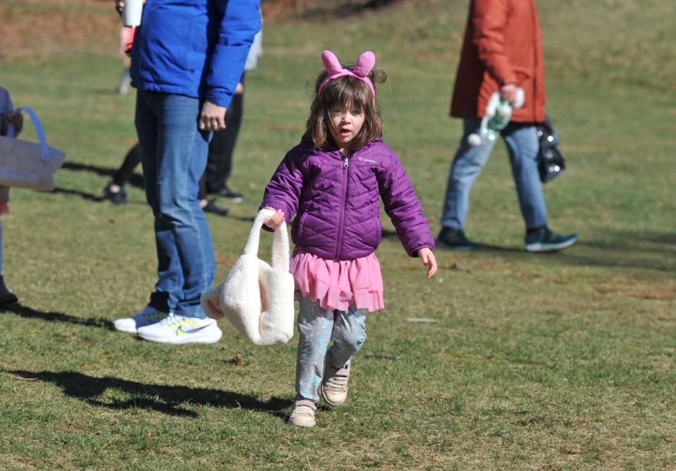 Stella Johannsen, 4, eyes Easter eggs during a hunt Sunday, April 2.