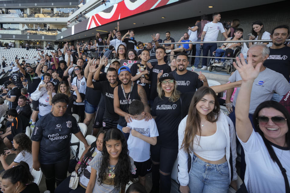 Corinthians soccer fans with autism spectrum disorder and their relatives watch a Brazilian soccer championship match between Corinthians and Cruzeiro at the Neo Quimica Arena in Sao Paulo, Brazil, Sunday, April 16, 2023. Brazilian soccer clubs are increasingly opening spaces for autistic fans to watch matches, mingle and celebrate the sport, an initiative that got even higher attention in April, when Autism Speaks celebrates World Autism Awareness Month. (AP Photo/Andre Penner)