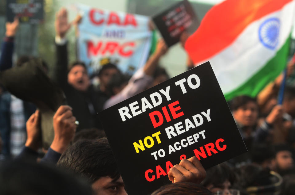 Protesters shout with placards during a demonstration against India's new citizenship law CAA ( Citizenship amandment Act ) in Allahabad on December 19,2019 . Indians defied bans nationwide as anger swells against a citizenship law seen as discriminatory against muslims, following days of protest, clashes, and riots that have left six dead .(Photo by Ritesh Shukla/NurPhoto via Getty Images)