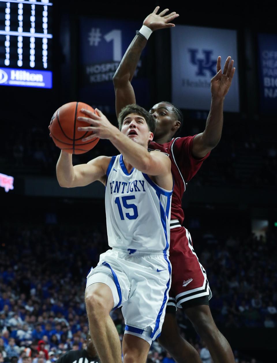 UK's Reed Sheppard (15) got to the basket against New Mexico State's Jaylin Jackson-Posey (0) during their game at Rupp Arena in Lexington, Ky. on Nov. 6, 2023.