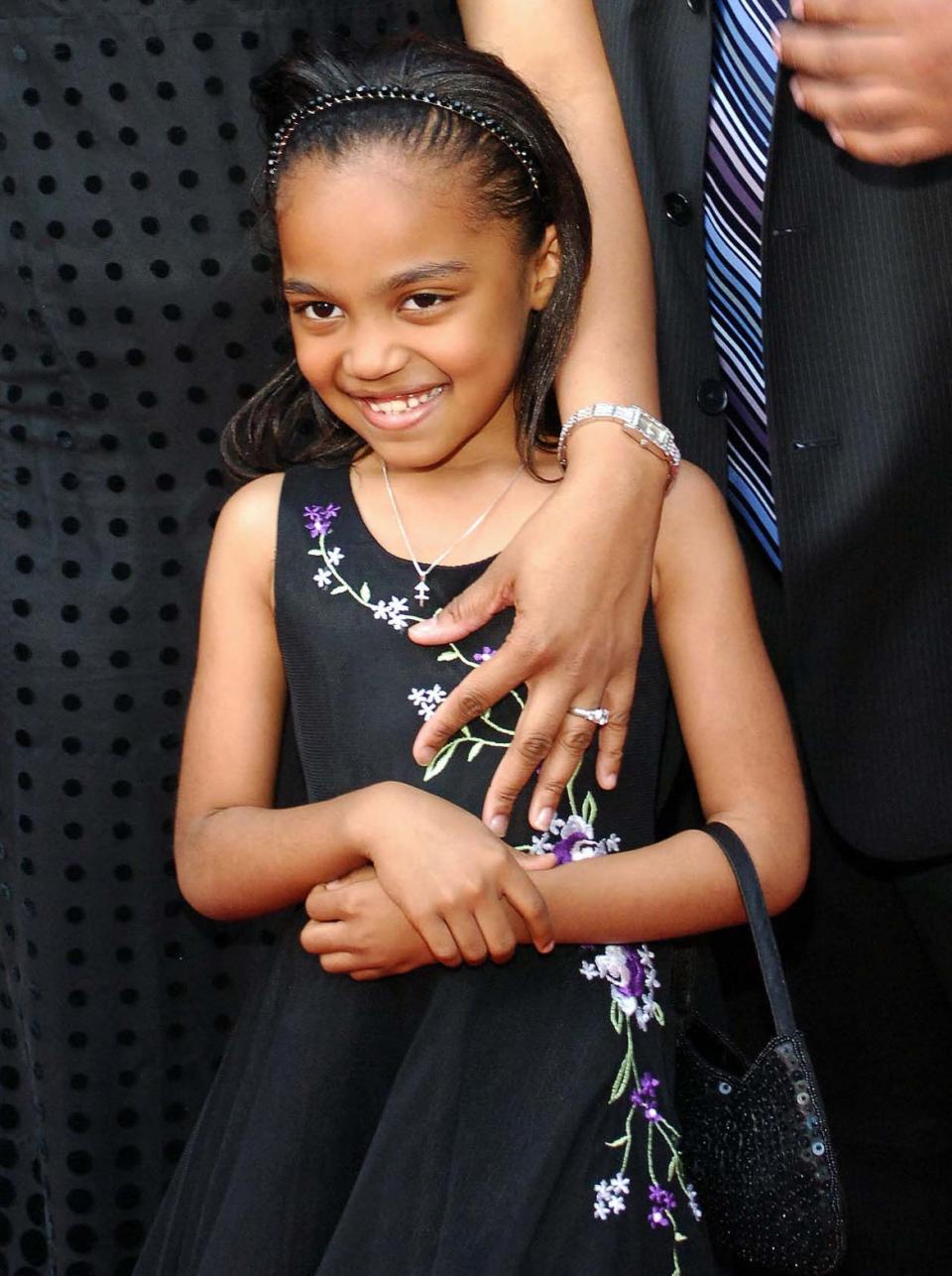 very young china wearing a floral dress