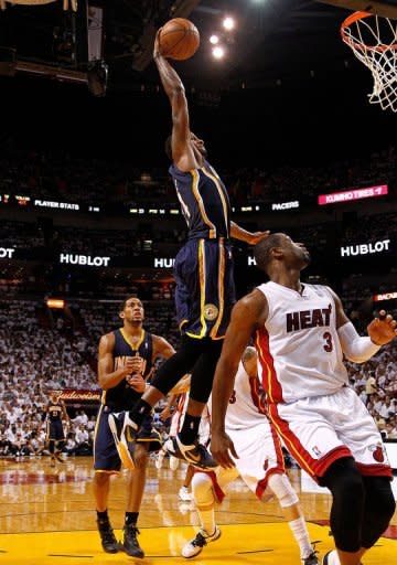 Paul George of the Indiana Pacers dunks over Dwyane Wade of the Miami Heat during Game Two of the Eastern Conference Semifinals in the 2012 NBA Playoffs on May 15, 2012 in Miami, Florida