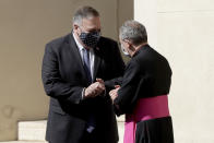 U.S. Secretary of State Mike Pompeo, left, greets Monsignor Joseph Murphy, head of Vatican protocol, after meeting Vatican Secretary of State Cardinal Pietro Parolin, at the Vatican, Thursday, Oct. 1, 2020. Pompeo is meeting Thursday with top Vatican officials, a day after tensions over U.S. opposition to the Vatican's China policy spilled out in public. (AP Photo/Andrew Medichini)