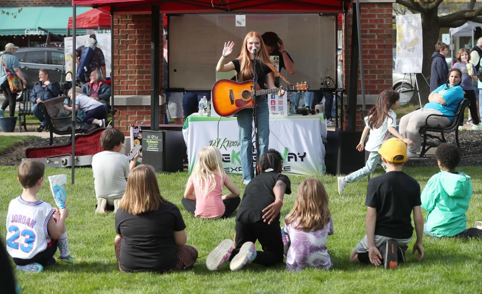 Musician Kendall Chalkwater performs at the Jo-Jo Festival in downtown Ravenna on Friday.