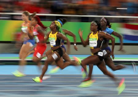 2016 Rio Olympics - Athletics - Final - Women's 100m Final - Olympic Stadium - Rio de Janeiro, Brazil - 13/08/2016. Elaine Thompson (JAM) of Jamaica (2nd from R) competes to win the gold medal in the women's 100m final. REUTERS/Phil Noble